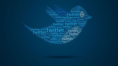 Twitter logo con letreros