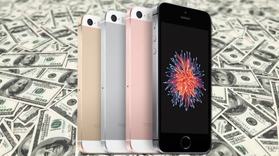 iPhone SE y sus colores sobre fondo de dolares