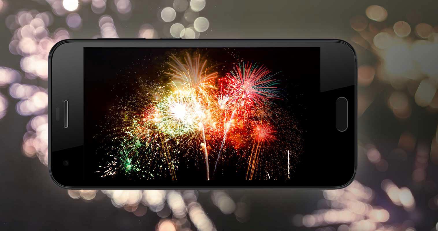 HTC One A9s negro con fuegos artificiales en la pantalla