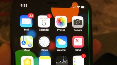 Pantalla del iPhone X con una línea verde