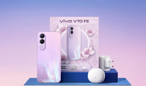 Teléfono Vivo V70 FE 5G en color violeta junto a su caja, cargador de pared y estuche de auriculares inalámbricos.