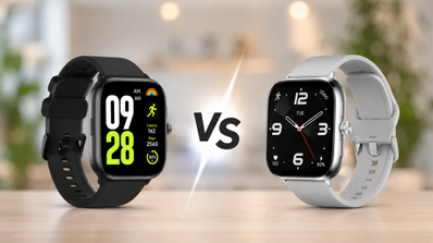 Comparativa visual entre el Redmi Watch 5 con correa negra y el Redmi Watch 6 con correa gris sobre una mesa.