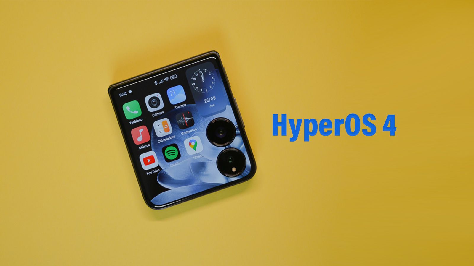 Pantalla externa de un teléfono plegable Xiaomi Mix Flip mostrando la interfaz HyperOS con diversos iconos de aplicaciones sobre un fondo amarillo.
