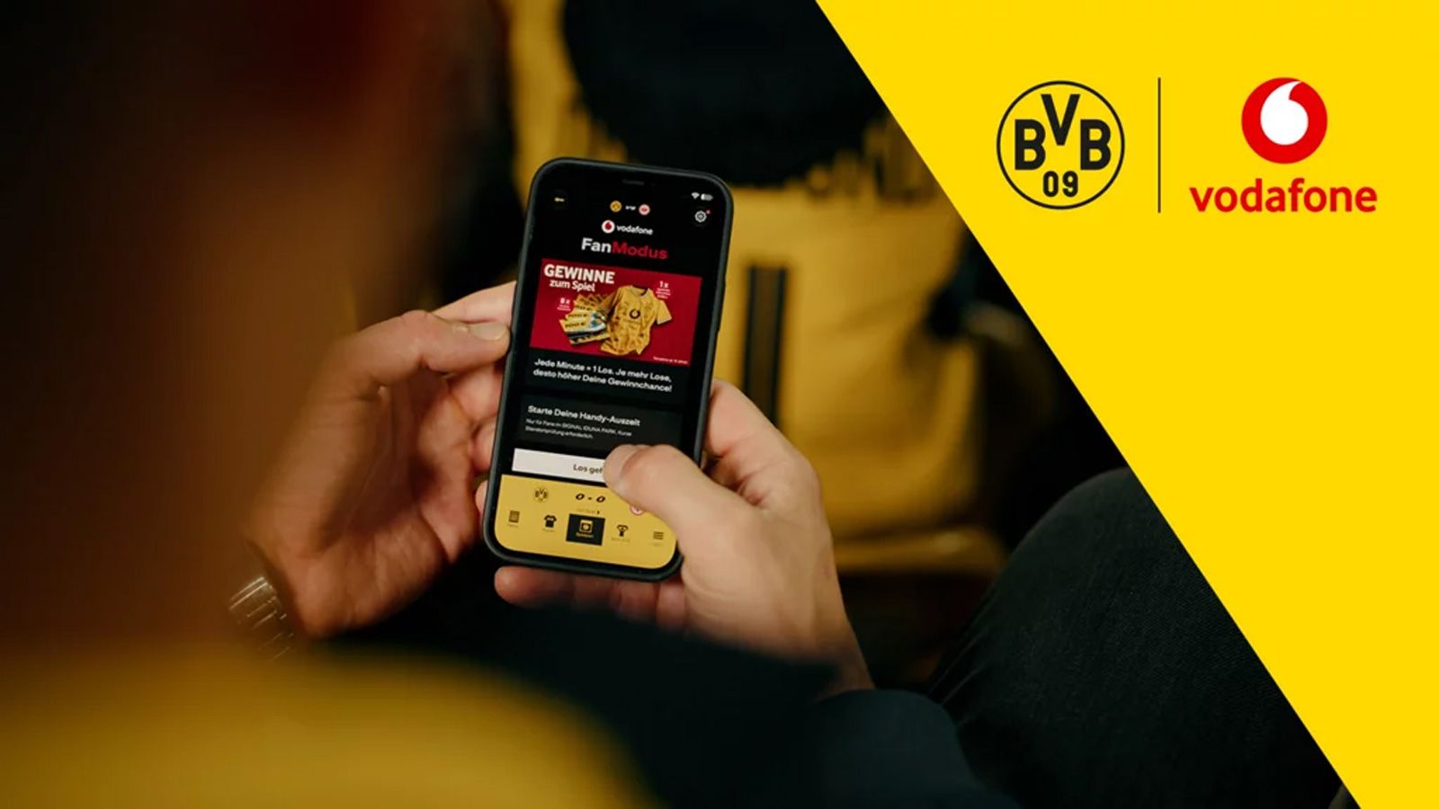 Interfaz de la aplicación Fan-Mode de Vodafone con contenido del Borussia Dortmund en un smartphone.