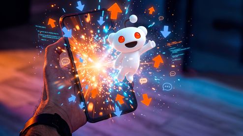 Snoo, el personaje de Reddit, saliendo de la pantalla de un teléfono móvil entre flechas de votos positivos y negativos.
